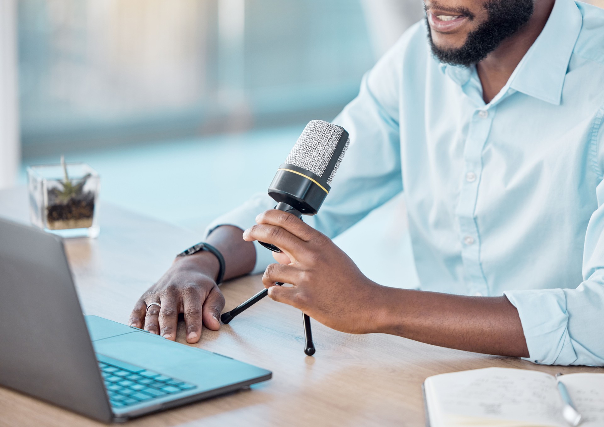 Shot of a man hosting a business podcast